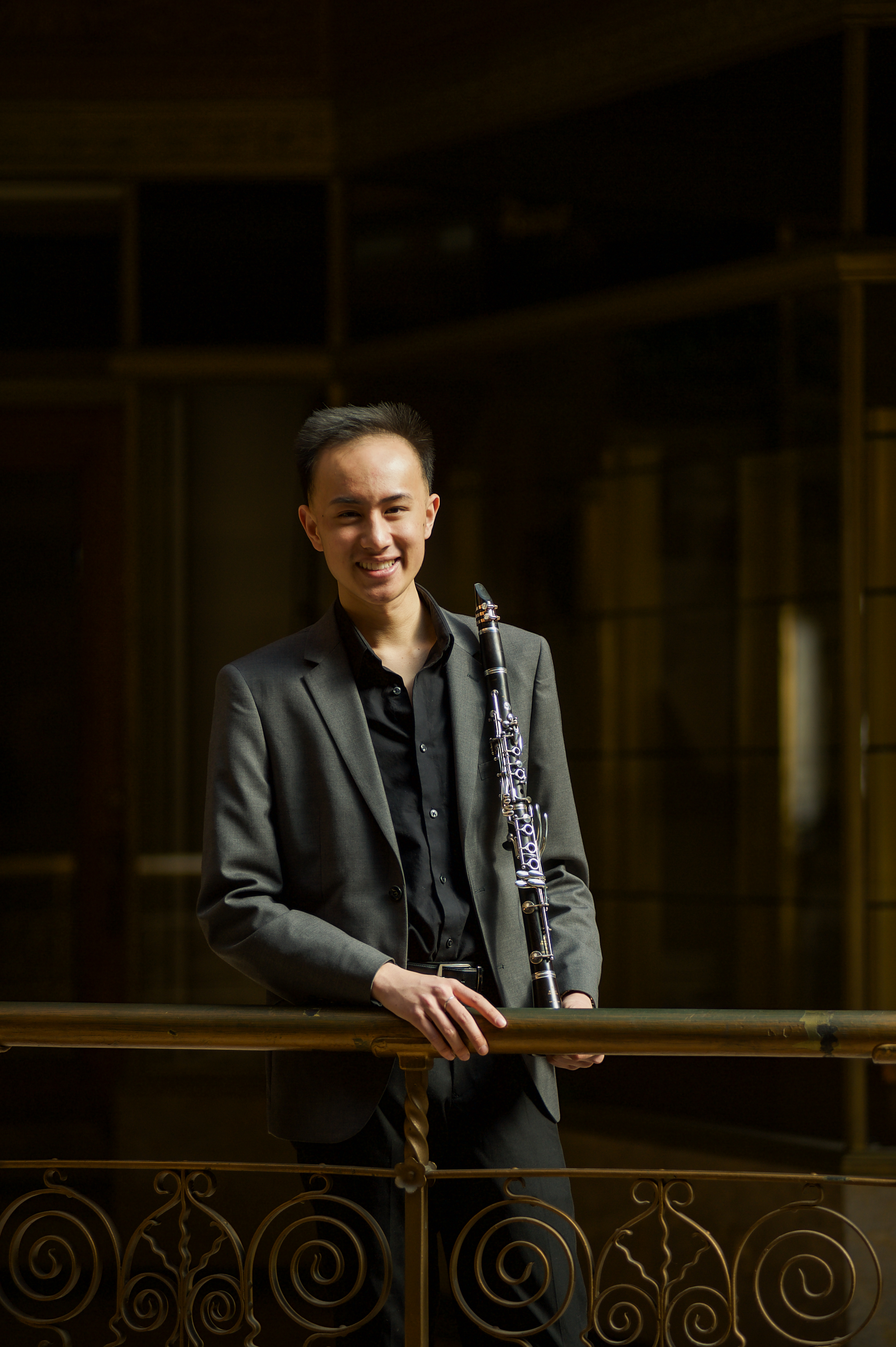 Khải Niên Nguyễn holding a clarinet